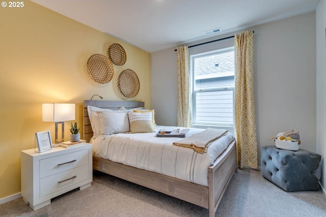 bedroom featuring light carpet