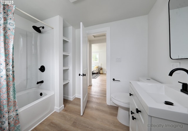 full bath with wood finished floors, shower / bath combo, toilet, vanity, and baseboards