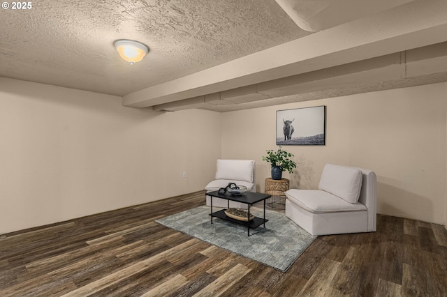 unfurnished room featuring dark hardwood / wood-style floors and a textured ceiling