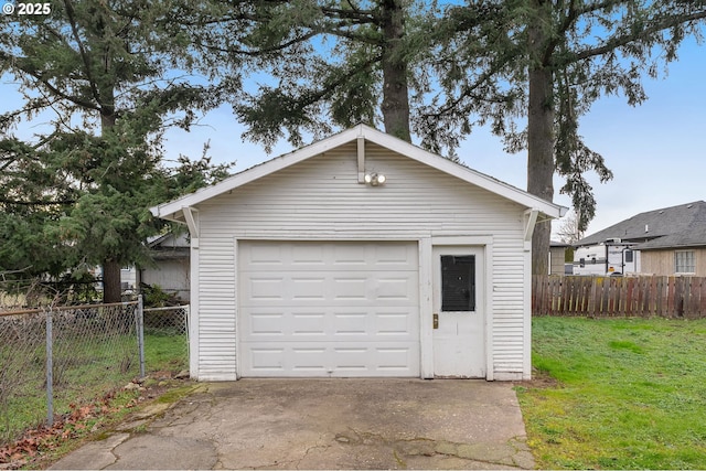 garage featuring a lawn