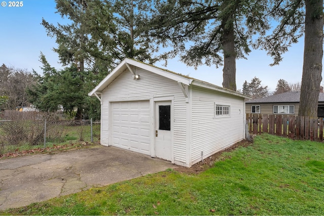 garage featuring a lawn