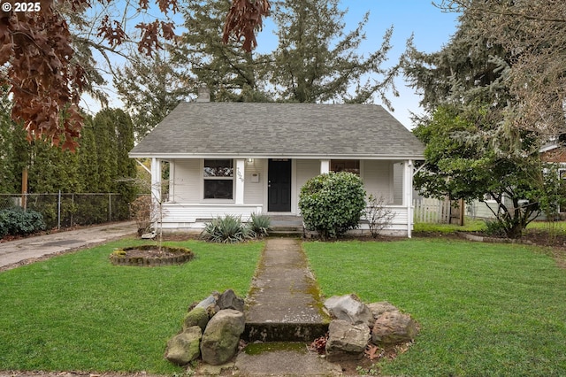 bungalow-style house featuring a front yard and covered porch