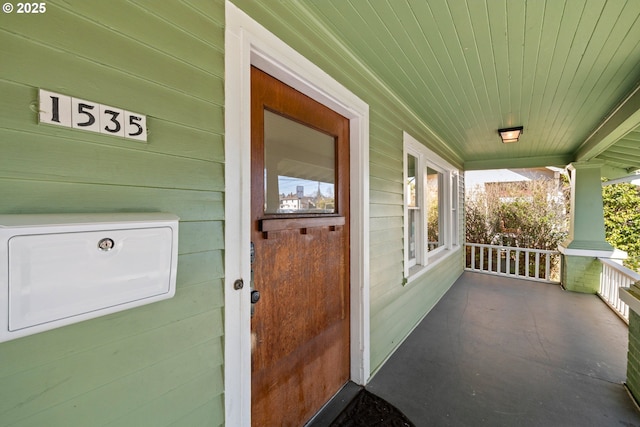 doorway to property featuring a porch