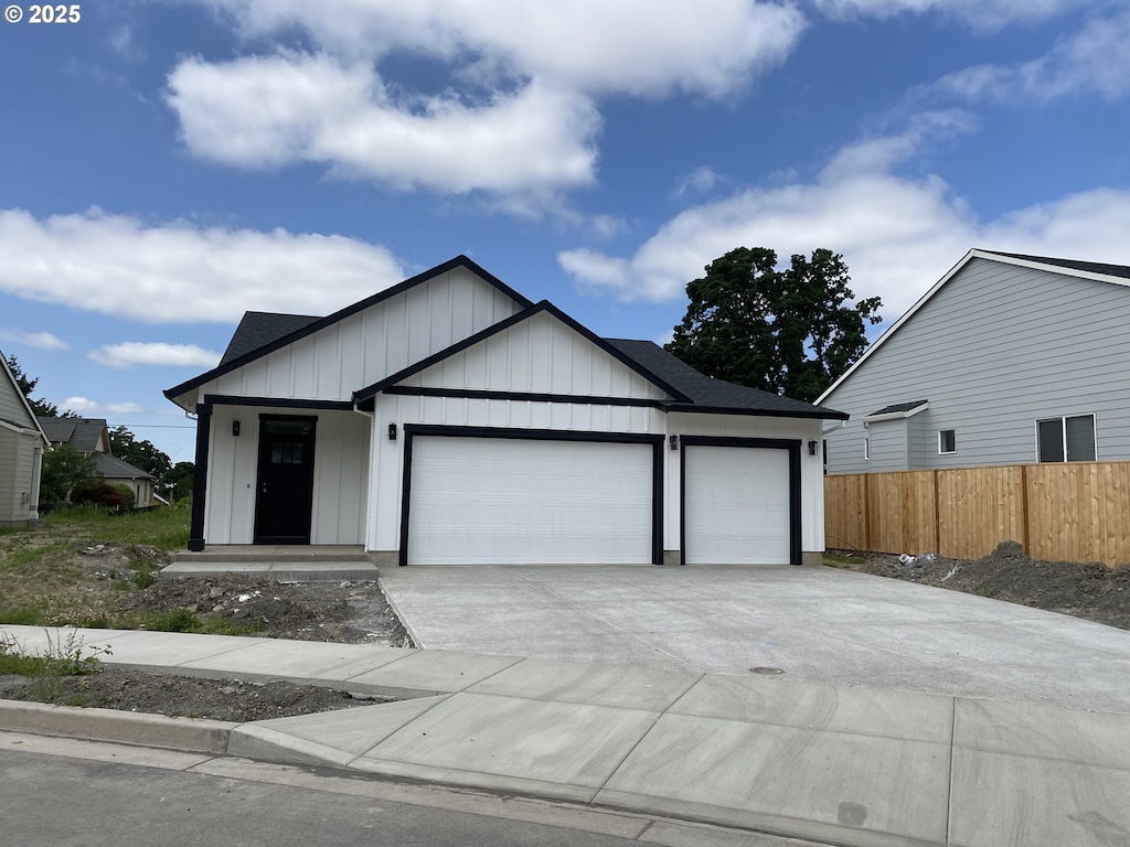 665 Parker Loop, Silverton, OR 97381 - view of front of home featuring a garage, driveway, and board and batten siding