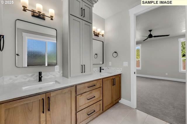 bathroom featuring vanity, tile patterned floors, and ceiling fan