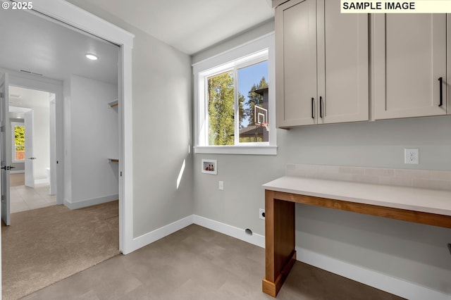 clothes washing area with cabinets, hookup for a washing machine, hookup for an electric dryer, and light carpet