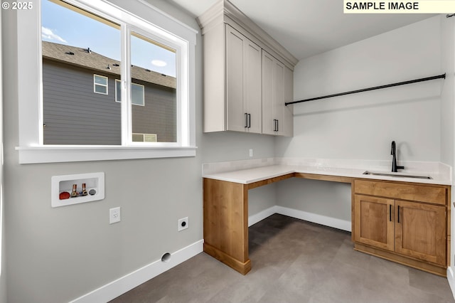 laundry area with cabinets, hookup for a washing machine, sink, and hookup for an electric dryer