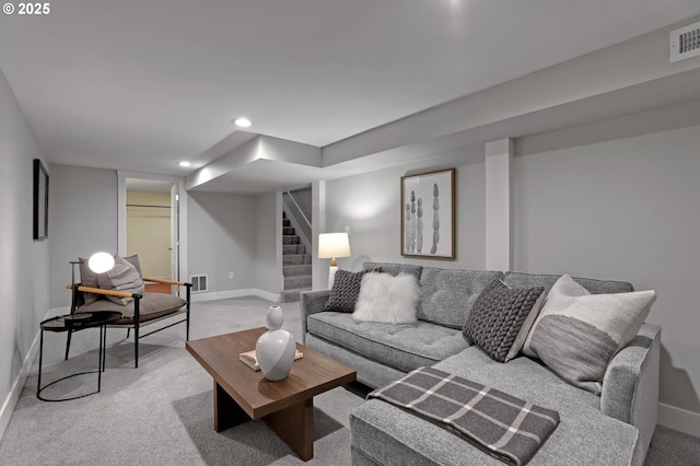 living room featuring light colored carpet, stairs, and baseboards