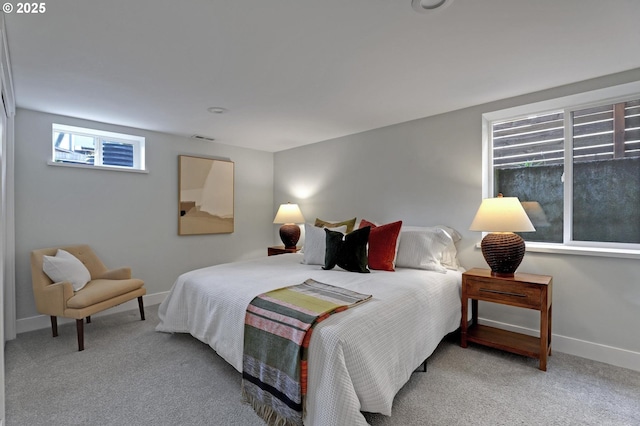 carpeted bedroom with visible vents and baseboards