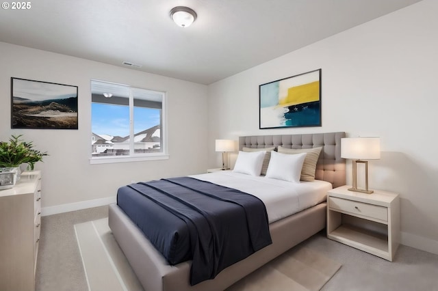 bedroom featuring light colored carpet