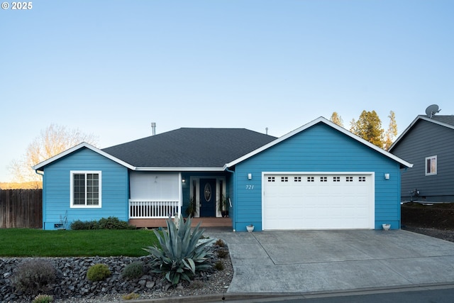 721 N Summerwood St, Roseburg, OR 97471 - single story home with concrete driveway, an attached garage, a front lawn, a porch, and a shingled roof