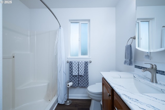 721 N Summerwood St, Roseburg, OR 97471 - full bathroom with wood finished floors, toilet, a shower with shower curtain, and a wealth of natural light