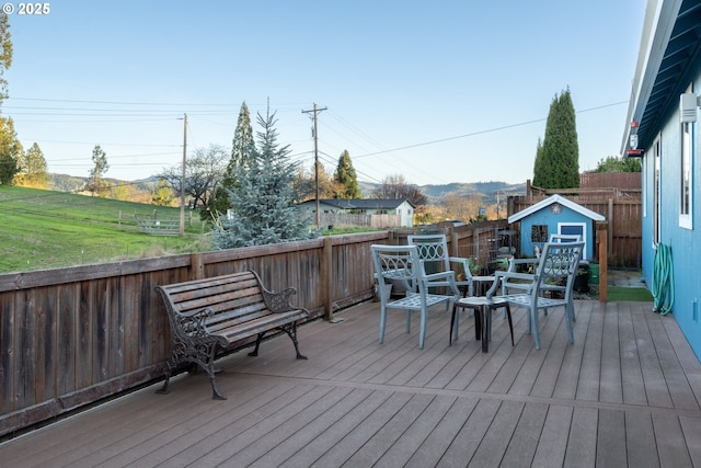 721 N Summerwood St, Roseburg, OR 97471 - deck with a fenced backyard, a shed, and an outdoor structure