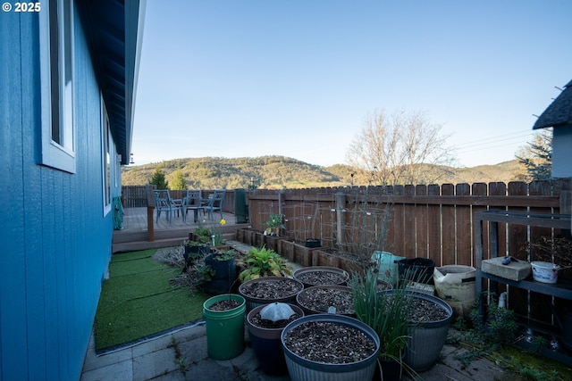 721 N Summerwood St, Roseburg, OR 97471 - view of yard featuring fence and a deck with mountain view