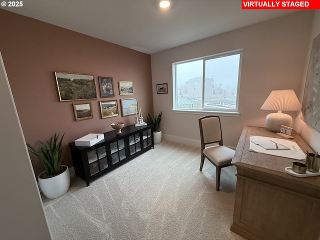 office with light colored carpet and baseboards