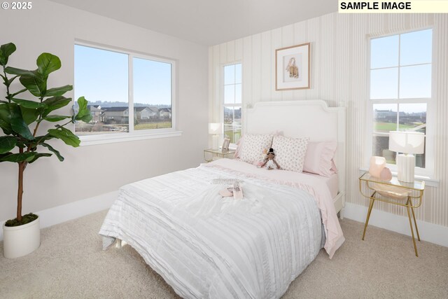 bedroom with baseboards, multiple windows, and carpet floors