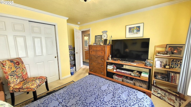 carpeted bedroom featuring crown molding and a closet