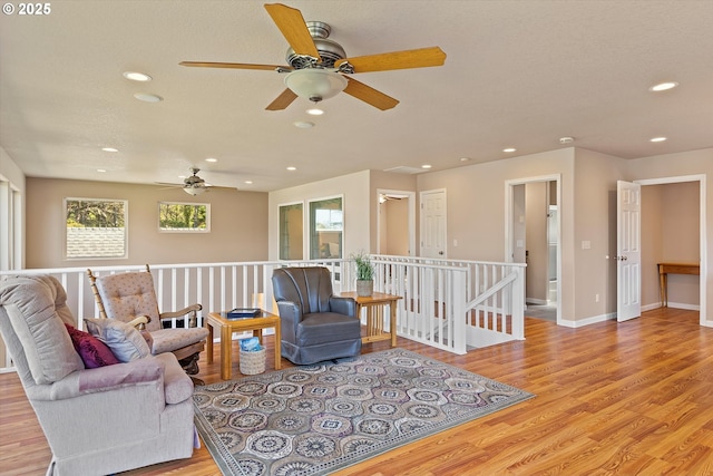 5220 SW Neal Ave, Waldport, OR 97394 - living area with ceiling fan, wood finished floors, recessed lighting, and baseboards
