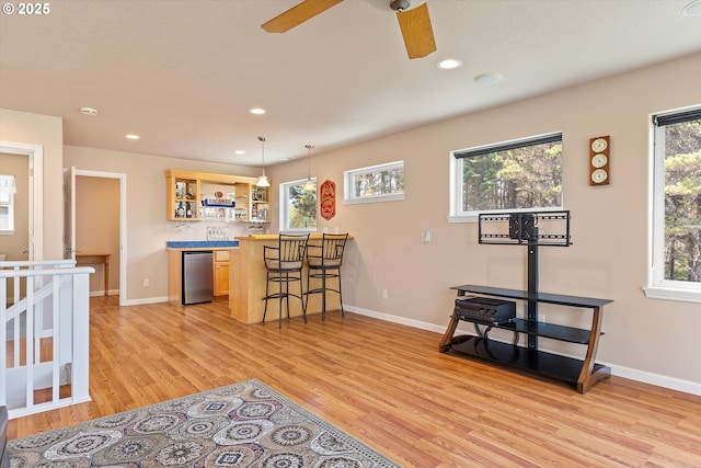 5220 SW Neal Ave, Waldport, OR 97394 - kitchen with open shelves, light wood finished floors, refrigerator, a ceiling fan, and recessed lighting