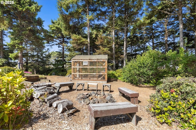 5220 SW Neal Ave, Waldport, OR 97394 - view of yard with an exterior structure and an outdoor structure