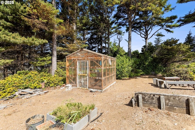 5220 SW Neal Ave, Waldport, OR 97394 - view of yard with an exterior structure, an outbuilding, and a vegetable garden