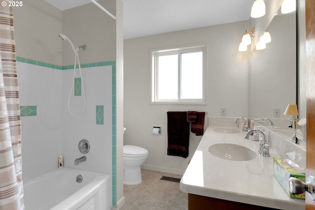 full bathroom featuring visible vents, toilet, shower / bath combo with shower curtain, and a sink