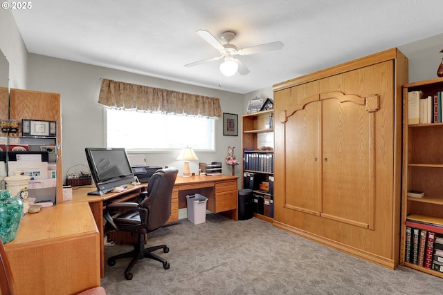 office area featuring light carpet and ceiling fan