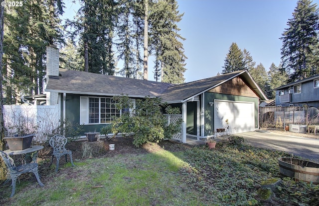 ranch-style home featuring a garage