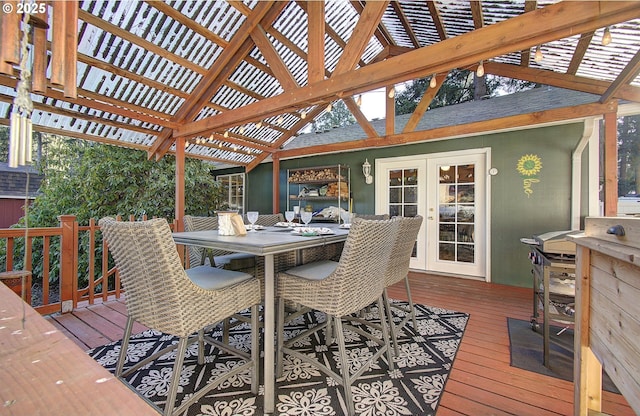 wooden deck with french doors and a pergola