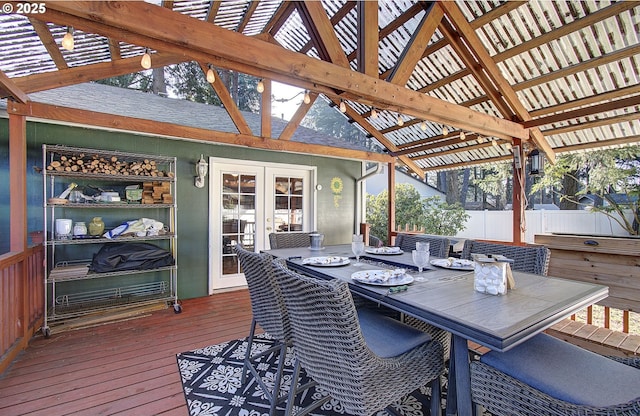 wooden terrace featuring french doors and a pergola