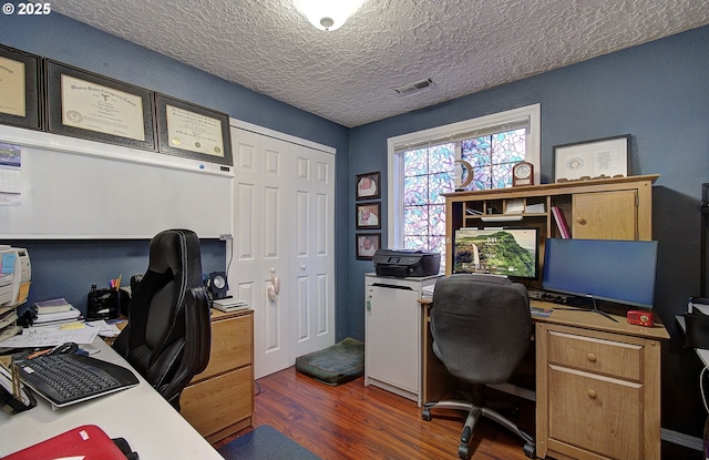 office featuring dark hardwood / wood-style flooring and a textured ceiling