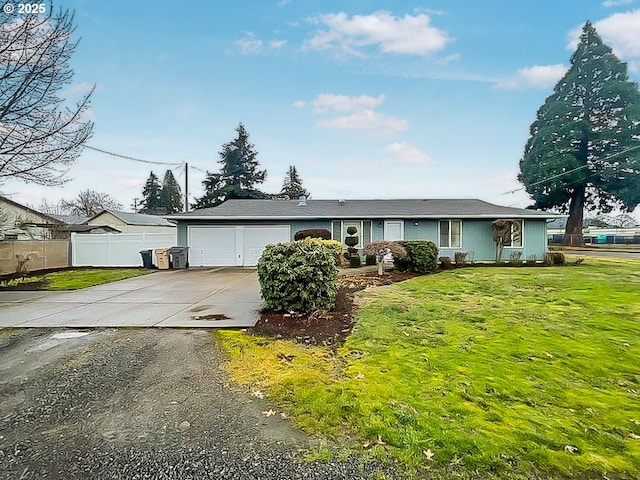 single story home featuring concrete driveway, fence, a front lawn, and an attached garage