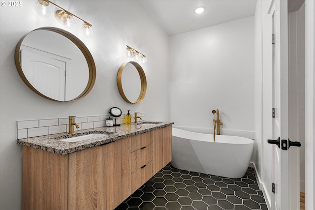 1905 2nd St, Baker City, OR 97814 - bathroom featuring double vanity, a freestanding bath, tile patterned floors, and recessed lighting