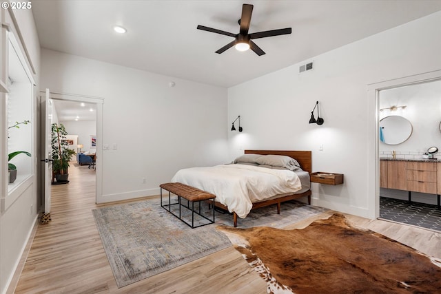 1905 2nd St, Baker City, OR 97814 - bedroom featuring light wood-style flooring, baseboards, connected bathroom, recessed lighting, and a ceiling fan