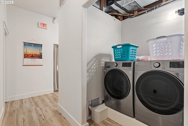1905 2nd St, Baker City, OR 97814 - laundry room featuring separate washer and dryer, wood finished floors, and baseboards