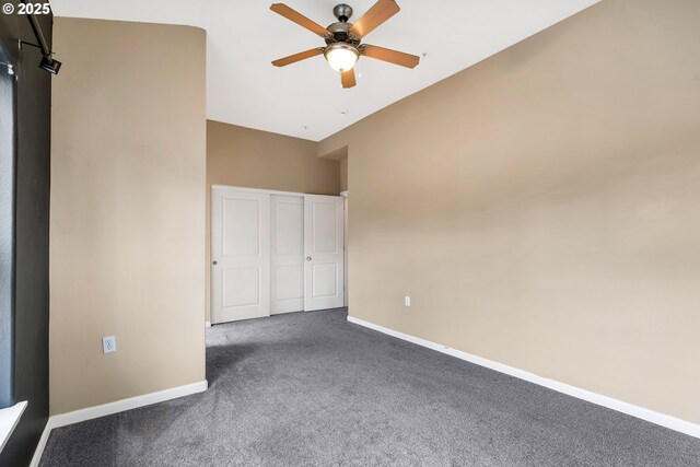 unfurnished bedroom featuring a closet, carpet flooring, baseboards, and ceiling fan