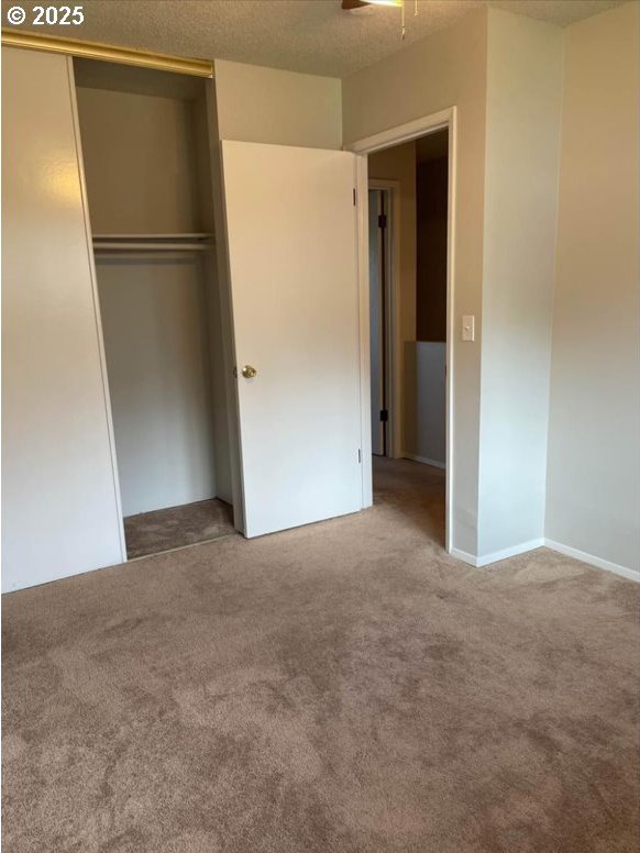 7820 SW 17th Dr, Portland, OR 97219 - unfurnished bedroom featuring carpet and a closet