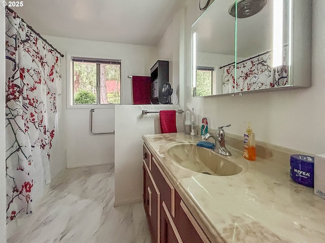 bathroom featuring a shower with shower curtain, marble finish floor, and vanity