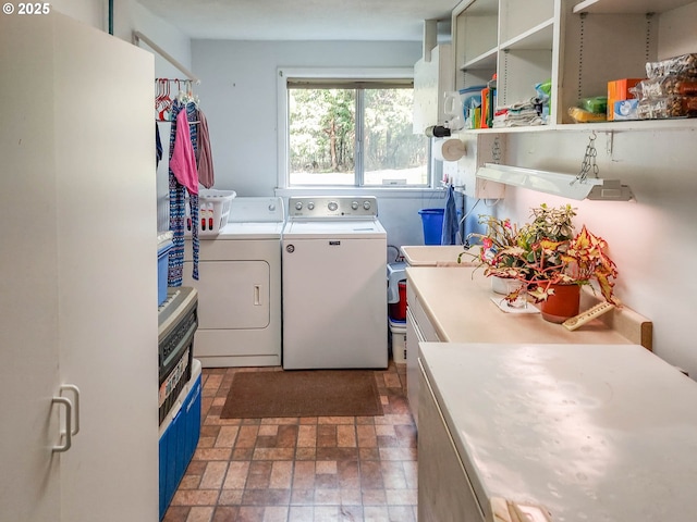 washroom with laundry area and washing machine and clothes dryer