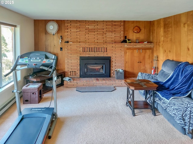 living area featuring a wealth of natural light, carpet flooring, and a fireplace