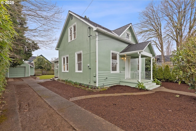 bungalow with an outbuilding and a garage