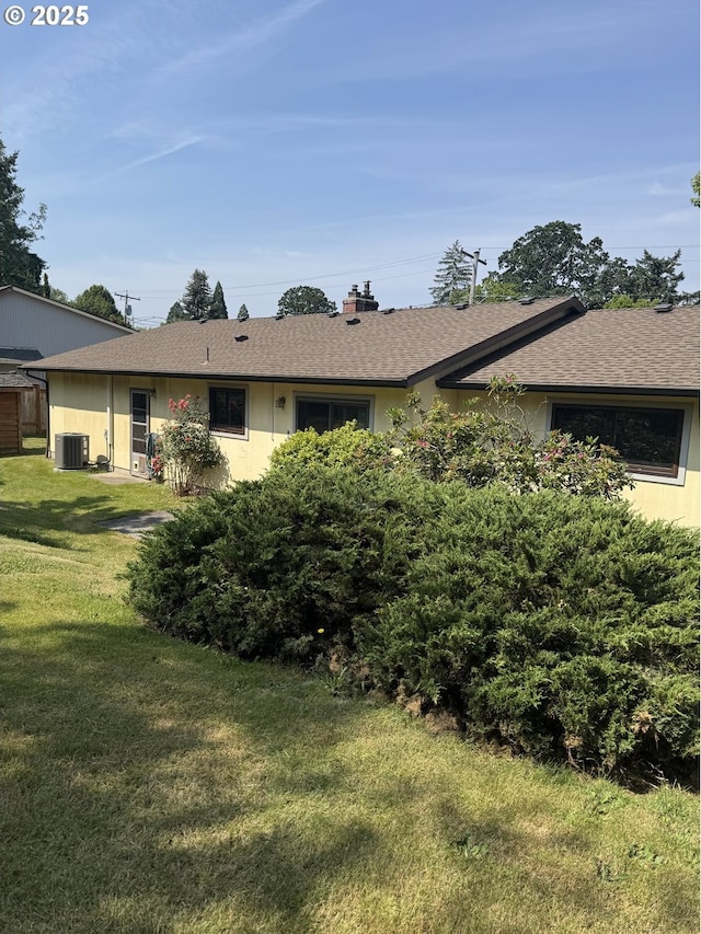 10930 SW 61st Ave, Portland, OR 97219 - rear view of property with a lawn, roof with shingles, a chimney, and stucco siding