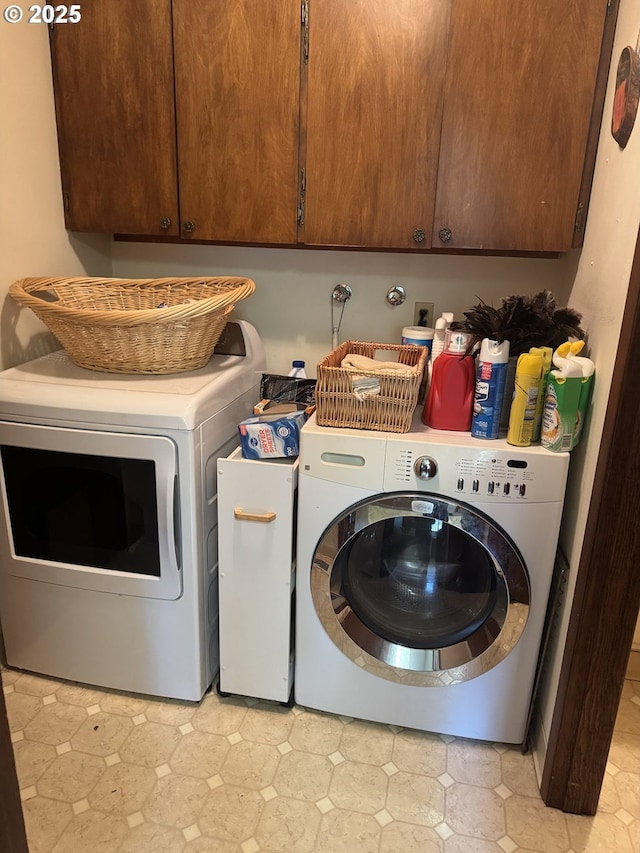 10930 SW 61st Ave, Portland, OR 97219 - laundry area with cabinet space, washer and clothes dryer, and light floors