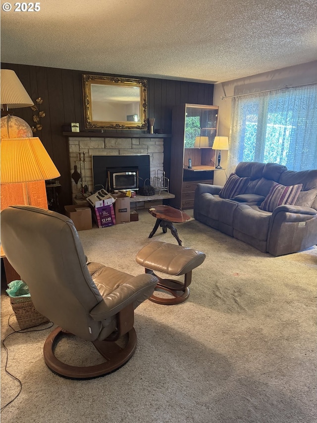 10930 SW 61st Ave, Portland, OR 97219 - carpeted living area featuring a stone fireplace, a textured ceiling, and wooden walls