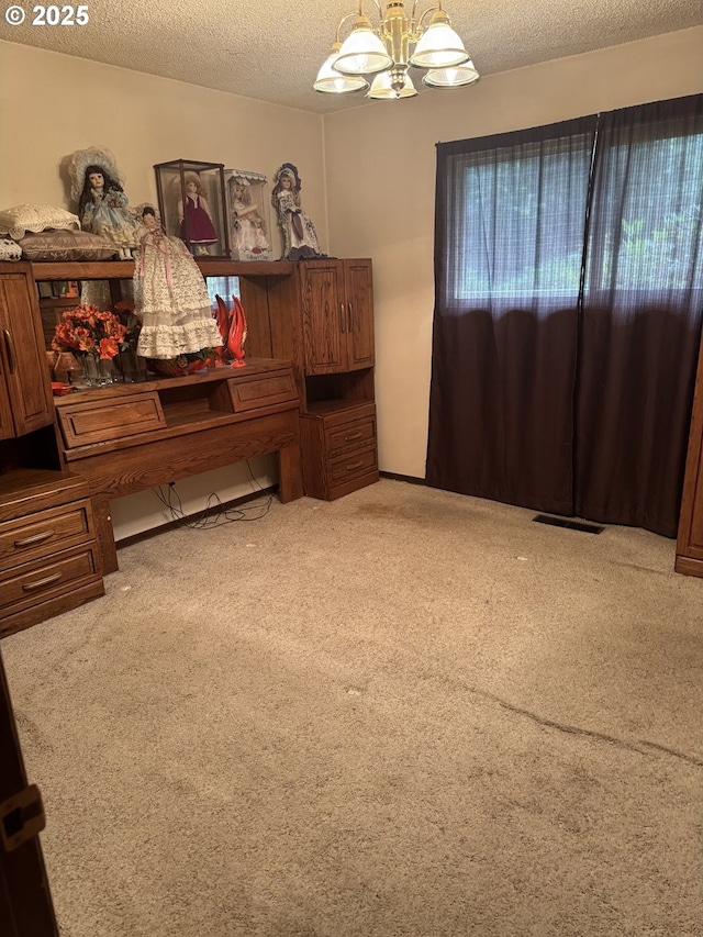 10930 SW 61st Ave, Portland, OR 97219 - carpeted bedroom featuring a chandelier and a textured ceiling