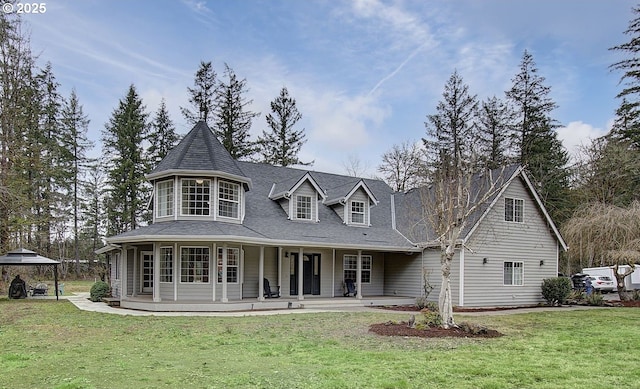 view of front of property with a gazebo and a front yard