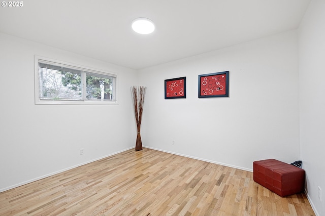 spare room with light hardwood / wood-style flooring