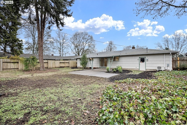 rear view of property featuring a patio area