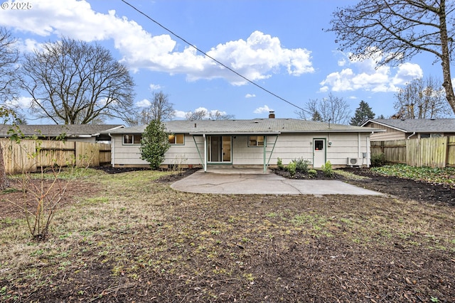 rear view of property featuring a patio area