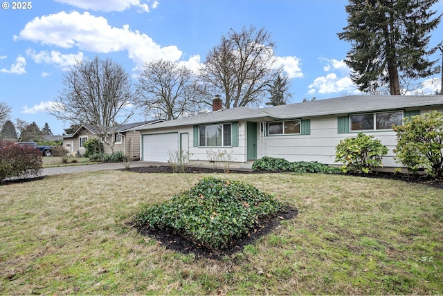 single story home featuring a garage and a front yard